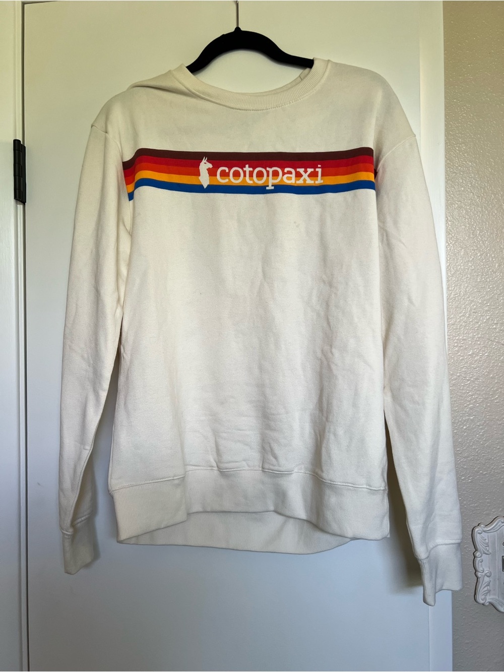 Cotopaxi Cream Sweatshirt with Retro Rainbow Chest Stripe L NWT